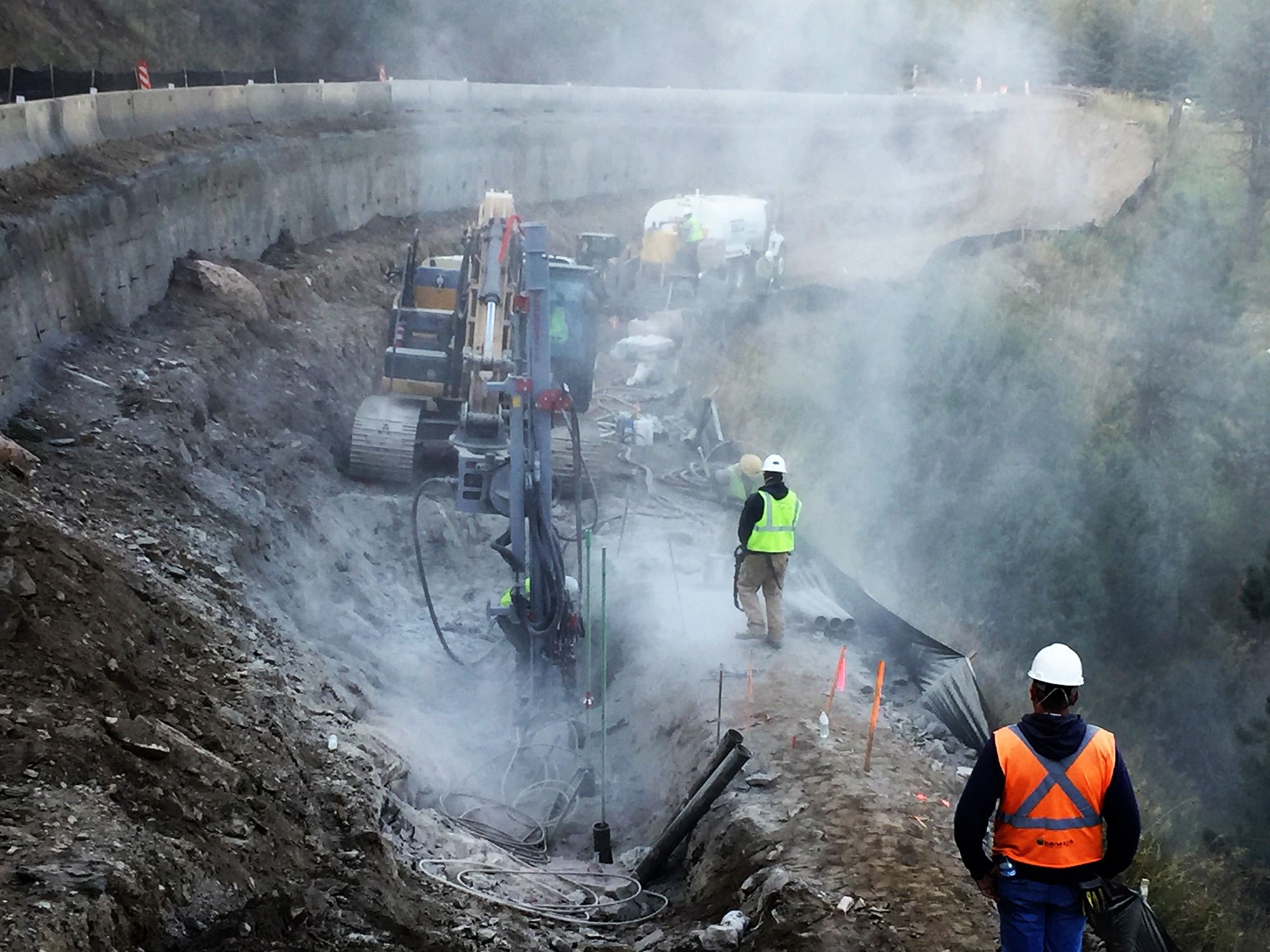Park Range crew drilling micropiles on a steep mountain job site