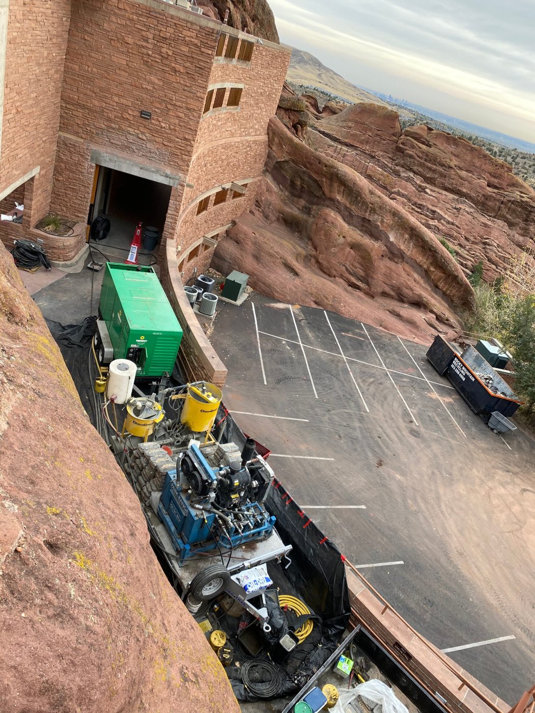 Park Range micropile rig and grout plant staged beside the red rocks behind the Red Rocks Amphitheatre stage