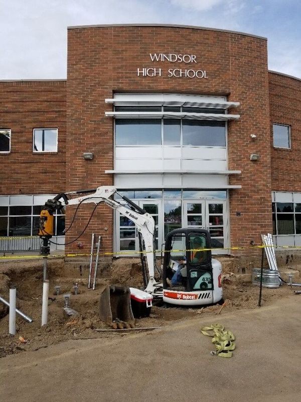Excavator working at the entrance of Windsor High School